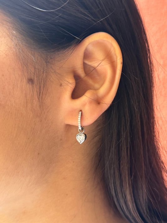 Close-up of an ear with a silver earring